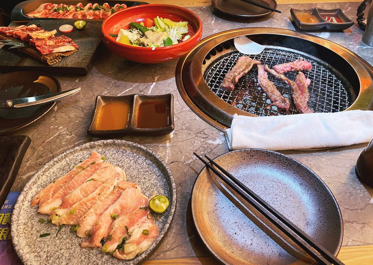toasting meat at a restaurant